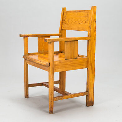 A mid-20th century pine armchair.